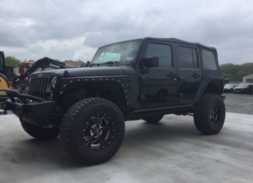 black 4 door softtop jeep-min